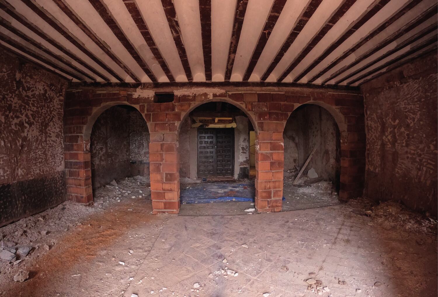 The room with its three new brick arches