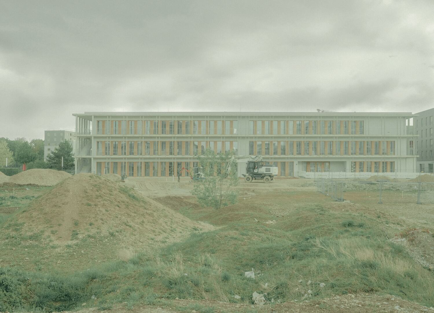 The buildings seen from the shaped topography