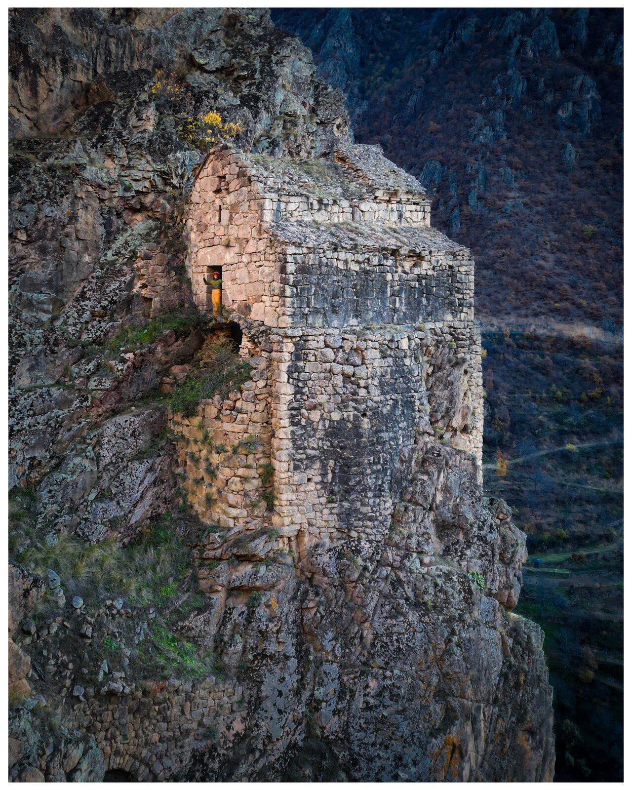 Nuka Sakdari on its shelf of rock, above the valley
