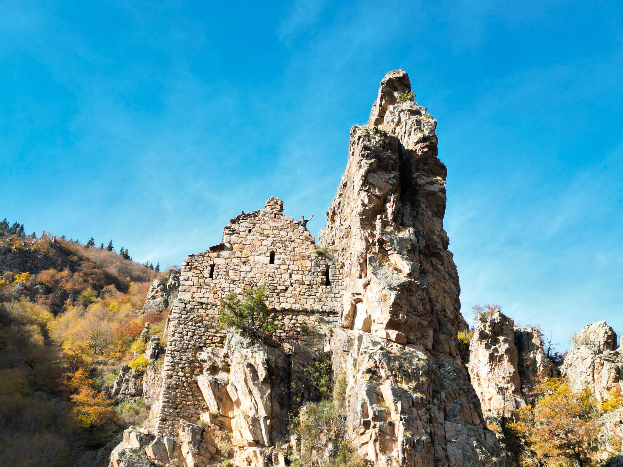 The church beside its needle of rock